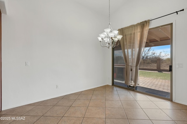 unfurnished dining area with a chandelier, baseboards, and tile patterned floors