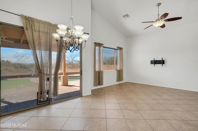 unfurnished dining area with light tile patterned floors, high vaulted ceiling, ceiling fan with notable chandelier, visible vents, and baseboards