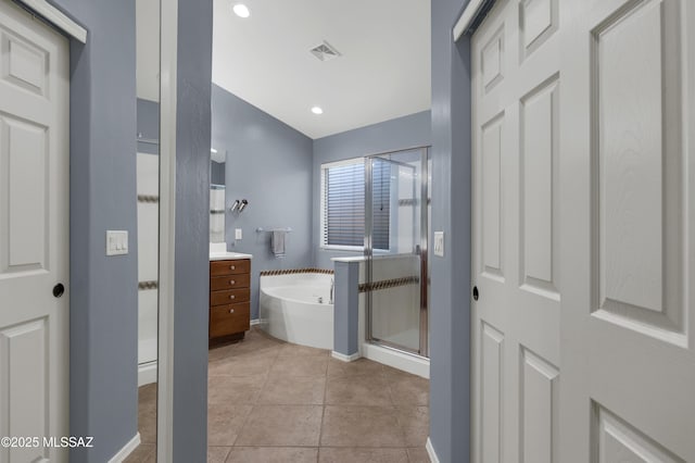 full bath featuring visible vents, a shower stall, a bath, baseboards, and tile patterned floors