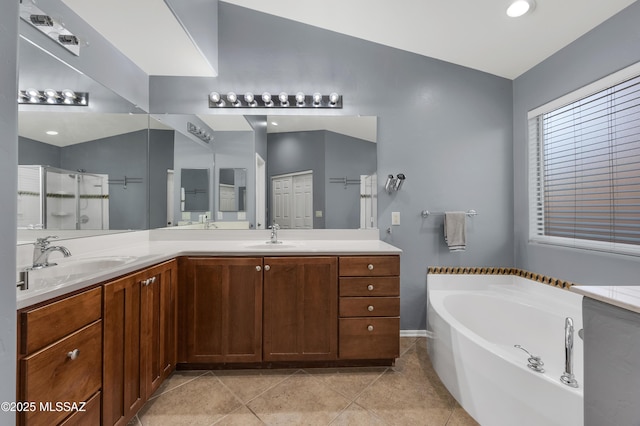 full bath with a stall shower, tile patterned floors, vanity, and a bath