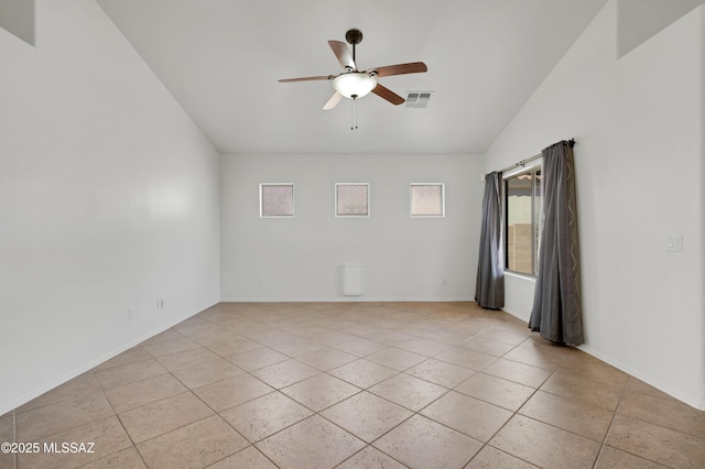 unfurnished room featuring light tile patterned floors, baseboards, visible vents, a ceiling fan, and lofted ceiling