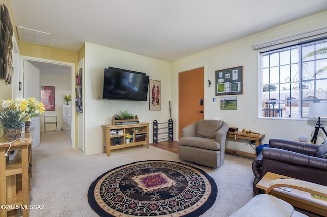 carpeted living area with visible vents