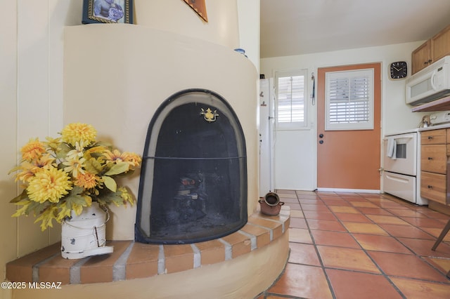 details featuring white microwave and electric stove