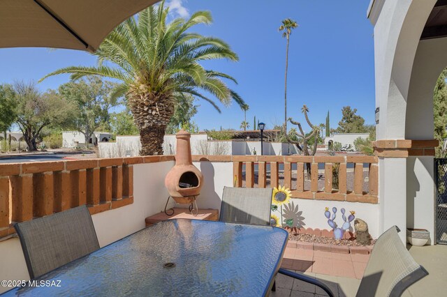 view of patio featuring outdoor dining area