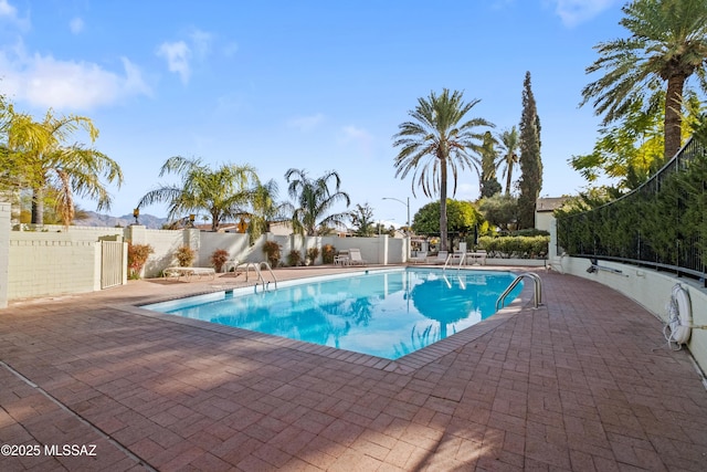 view of pool with a patio, fence, and a fenced in pool