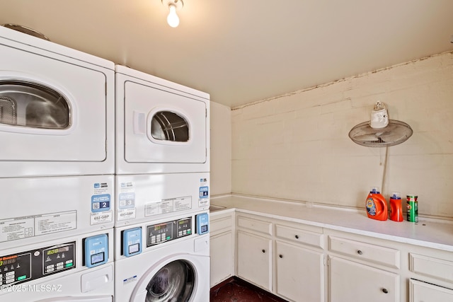 laundry room with washer and dryer and stacked washer and clothes dryer