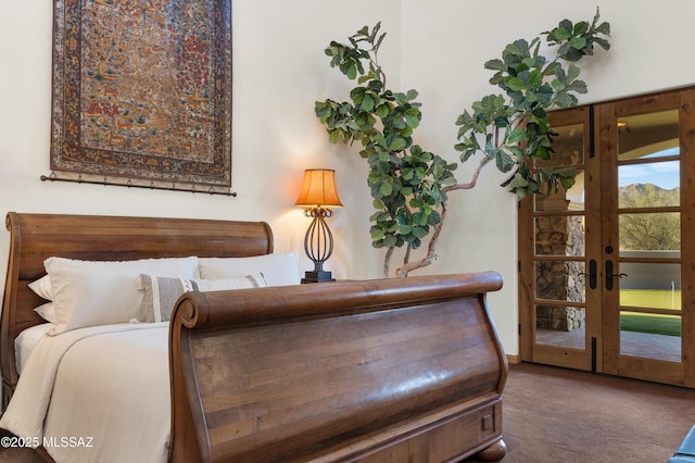 bedroom with french doors and carpet flooring