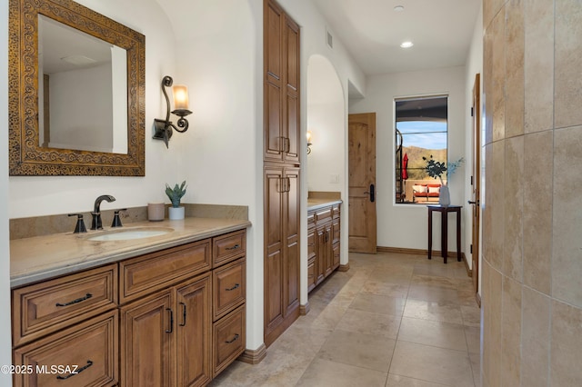 full bath featuring baseboards, visible vents, tile patterned floors, vanity, and a closet