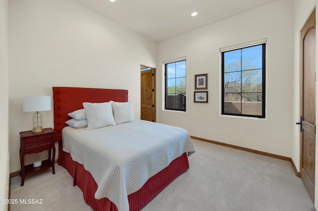 bedroom with recessed lighting, light colored carpet, and baseboards