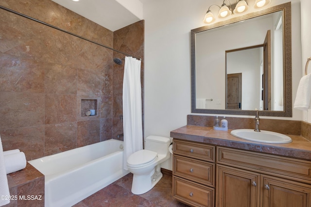 full bath with tile patterned flooring, vanity, toilet, and shower / bath combo with shower curtain