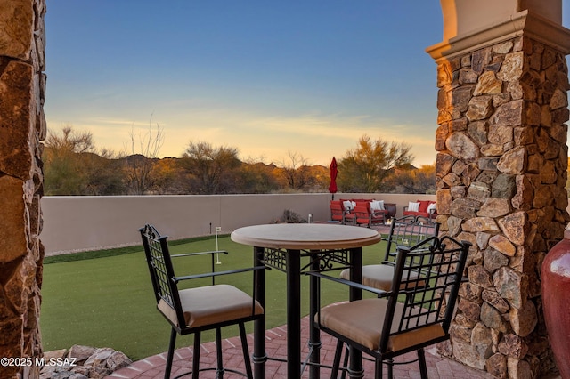 balcony at dusk with a patio