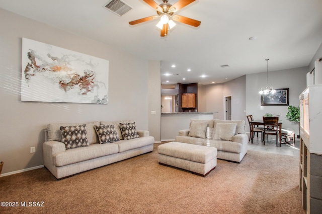 living room with light carpet, ceiling fan with notable chandelier, visible vents, and recessed lighting