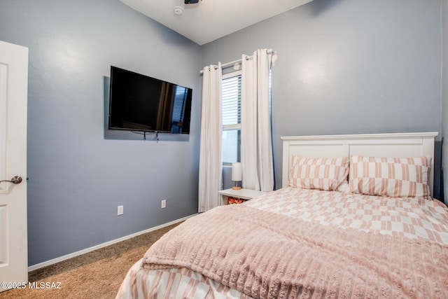 bedroom with carpet and baseboards