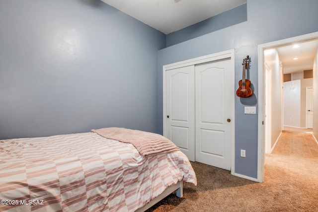 bedroom featuring carpet floors, a closet, and baseboards