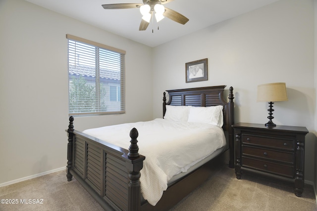 bedroom with baseboards, ceiling fan, and light colored carpet