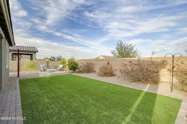 view of yard featuring a patio and a fenced backyard