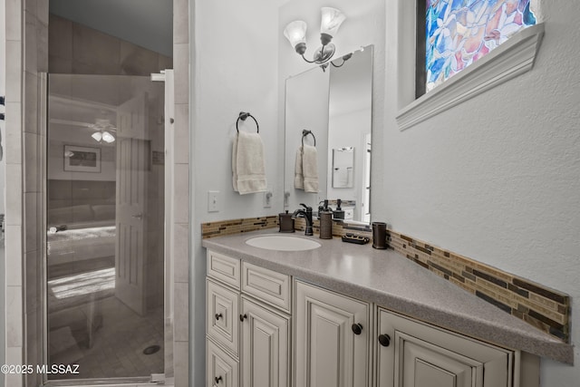 bathroom featuring vanity and a shower stall