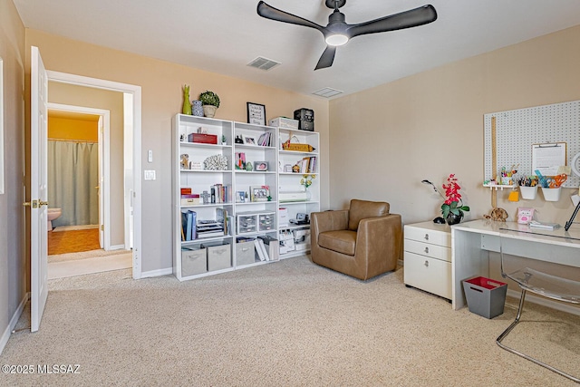 living area with carpet, visible vents, ceiling fan, and baseboards