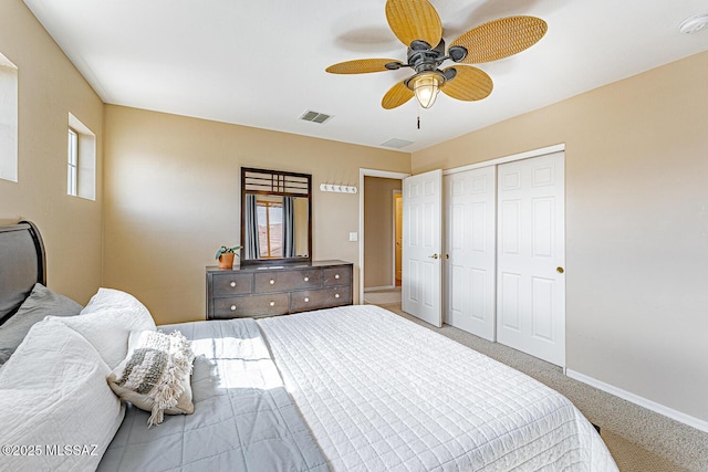 bedroom with carpet floors, a ceiling fan, visible vents, baseboards, and a closet