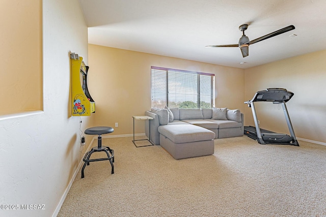 workout room featuring carpet, ceiling fan, and baseboards