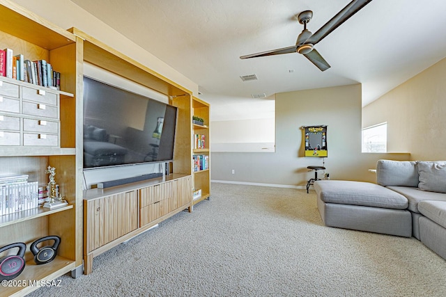 living area featuring a ceiling fan, carpet, visible vents, and baseboards