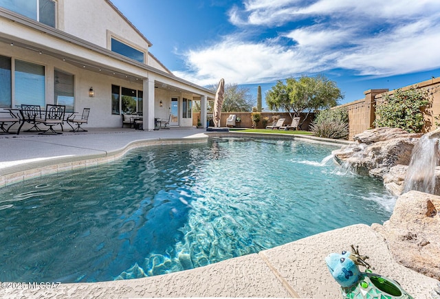 view of pool featuring a fenced backyard, a fenced in pool, and a patio