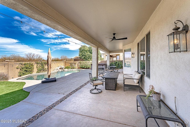 view of patio / terrace with ceiling fan, a fenced backyard, and a fenced in pool