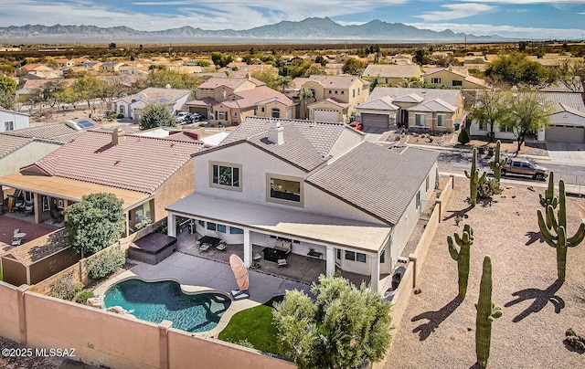 birds eye view of property with a residential view and a mountain view