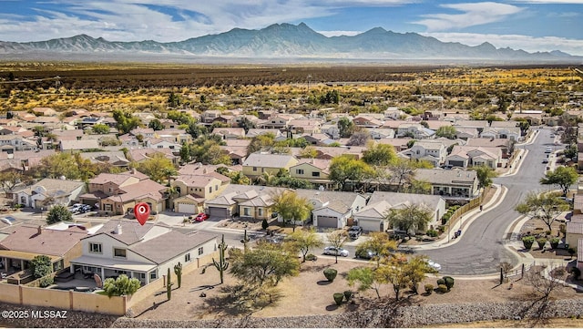 birds eye view of property with a residential view and a mountain view