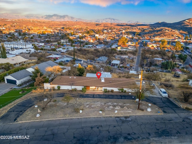 birds eye view of property with a residential view and a mountain view