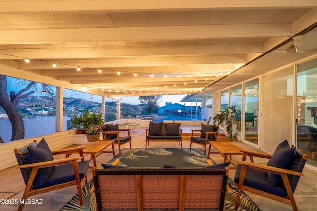 view of patio / terrace featuring a mountain view and an outdoor living space