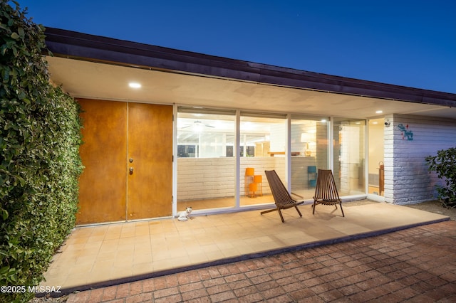 entrance to property with a patio