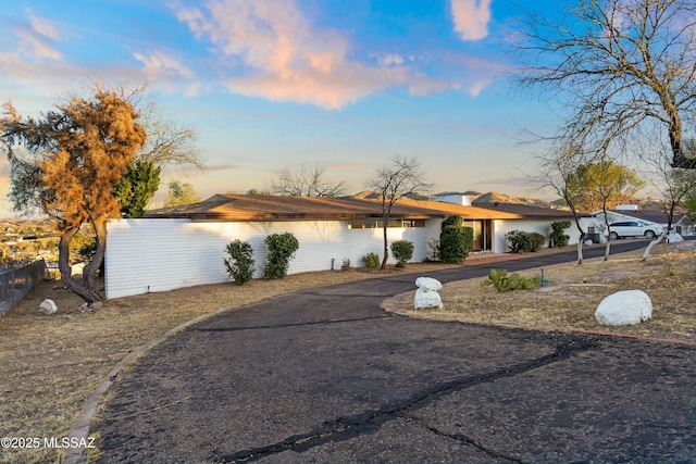 exterior space featuring fence and driveway