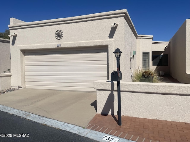 garage with concrete driveway