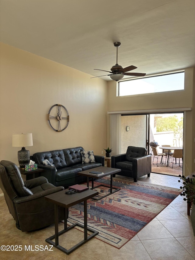 tiled living room featuring ceiling fan