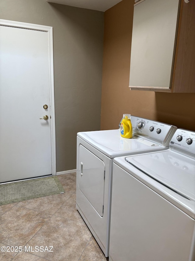 laundry room with cabinet space and washer and clothes dryer