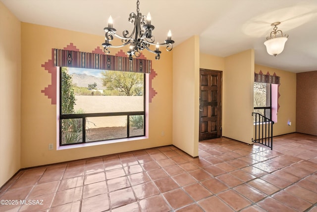 unfurnished dining area with an inviting chandelier and tile patterned flooring