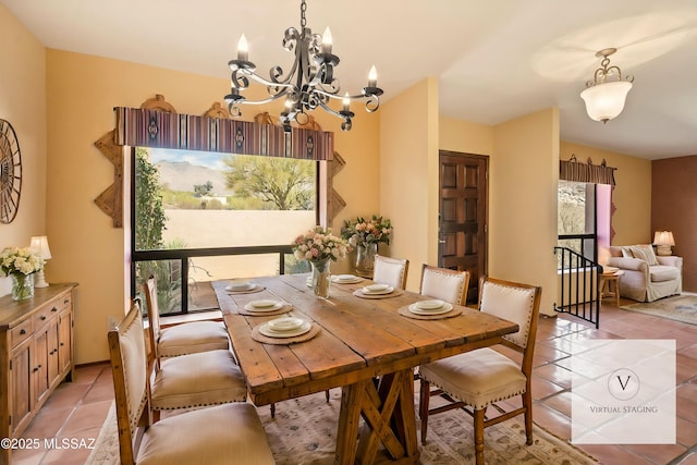 dining area featuring light tile patterned floors and a chandelier