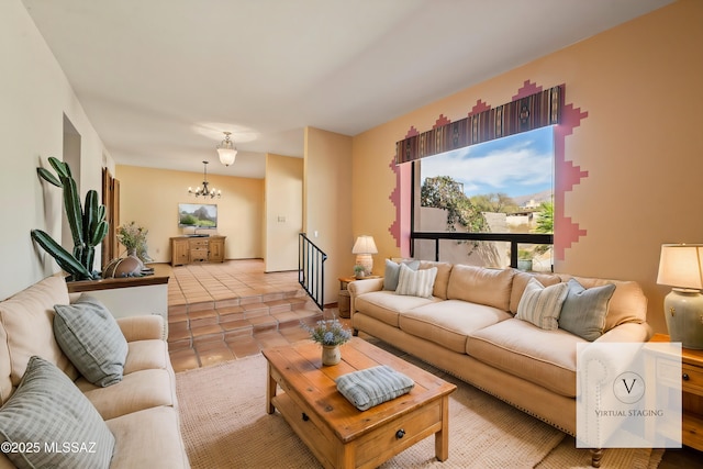 living area featuring light tile patterned floors and an inviting chandelier