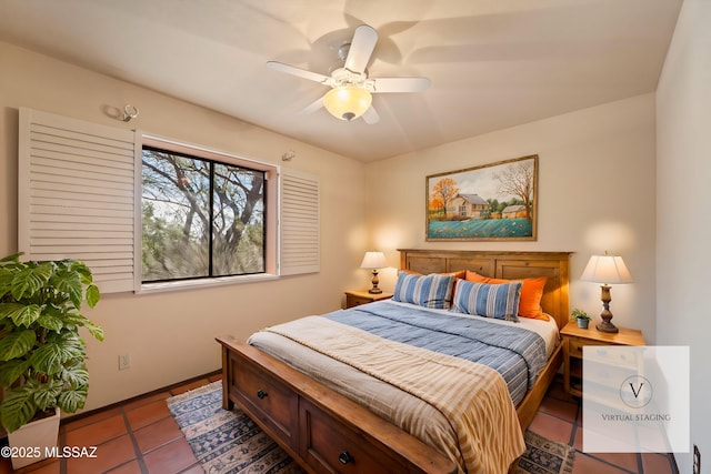 tiled bedroom featuring a ceiling fan