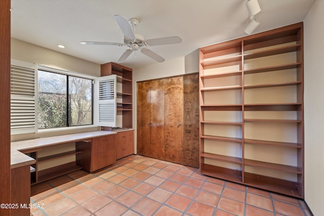 unfurnished office featuring recessed lighting, a ceiling fan, light tile patterned flooring, built in study area, and track lighting