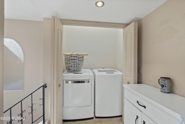 clothes washing area with washer and dryer and laundry area