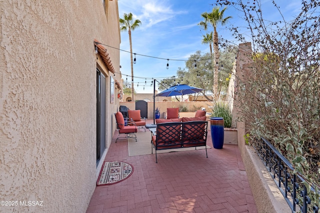 view of patio / terrace with fence and an outdoor living space