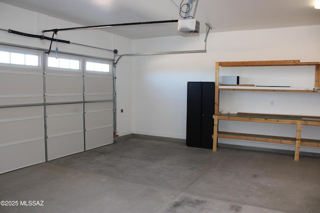 garage featuring baseboards and a garage door opener