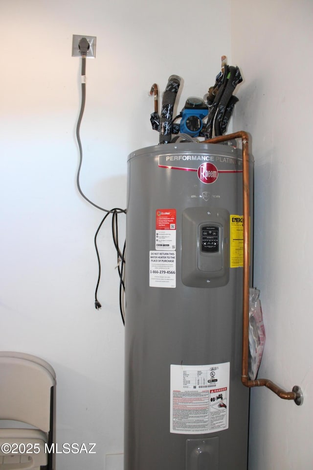 utility room featuring electric water heater