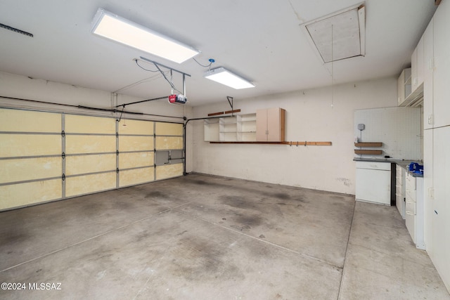 garage featuring refrigerator and a garage door opener