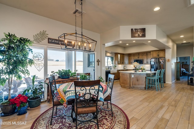 16 Star View Dr, Sonoita, AZ 85637 - dining area with light wood-style floors, a chandelier, and recessed lighting