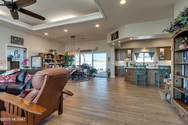 16 Star View Dr, Sonoita, AZ 85637 - living area featuring recessed lighting, a raised ceiling, healthy amount of natural light, a chandelier, and light wood finished floors
