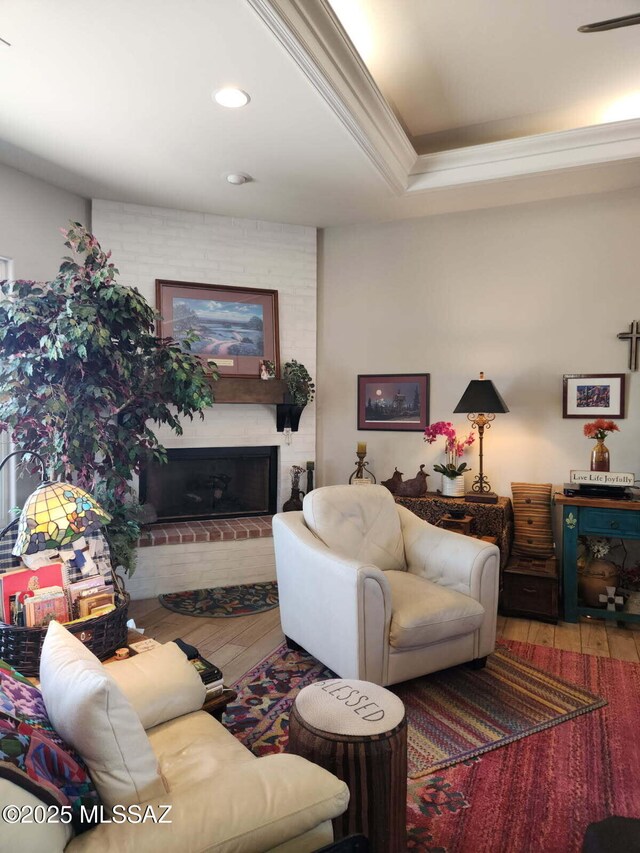 16 Star View Dr, Sonoita, AZ 85637 - living room featuring hardwood / wood-style floors, crown molding, a brick fireplace, and recessed lighting