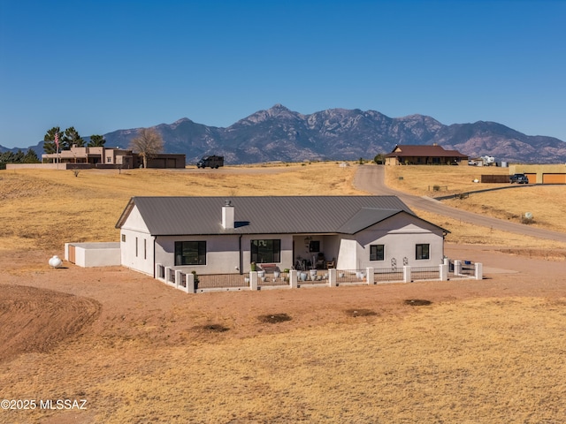 16 Star View Dr, Sonoita, AZ 85637 - back of property with a mountain view, metal roof, fence, and a patio
